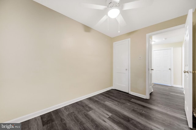 415 Arlington Ave, Upper Darby, PA 19082 - unfurnished bedroom with baseboards, dark wood-type flooring, and a ceiling fan
