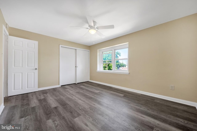 415 Arlington Ave, Upper Darby, PA 19082 - unfurnished bedroom with baseboards, a closet, dark wood-style flooring, and a ceiling fan