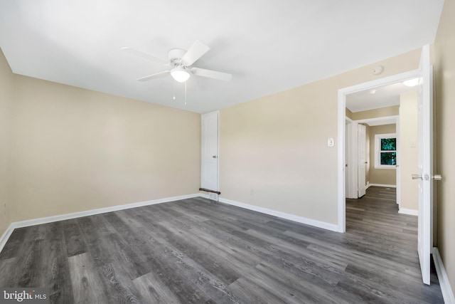 415 Arlington Ave, Upper Darby, PA 19082 - unfurnished room featuring dark wood-type flooring, a ceiling fan, and baseboards