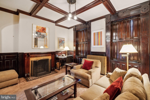 living area with radiator, coffered ceiling, beam ceiling, a fireplace, and ornamental molding