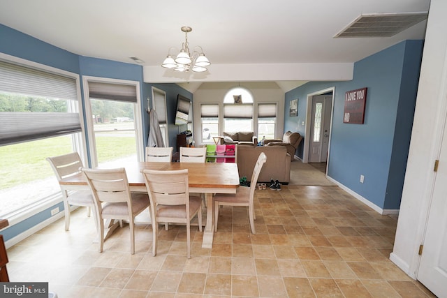 9557 Old Railroad Rd, Mardela Springs, MD 21837 - dining area with a chandelier, healthy amount of natural light, baseboards, and vaulted ceiling