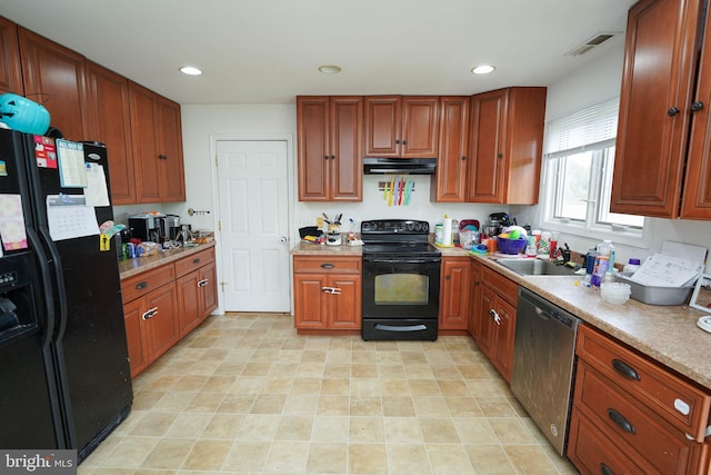 9557 Old Railroad Rd, Mardela Springs, MD 21837 - kitchen featuring black appliances, under cabinet range hood, a sink, light countertops, and recessed lighting