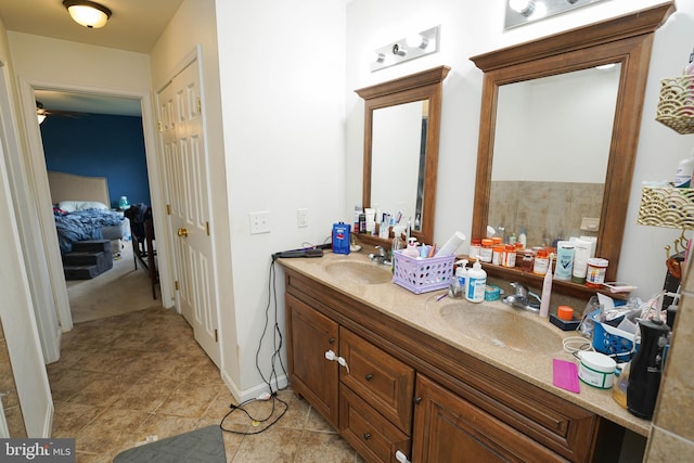 9557 Old Railroad Rd, Mardela Springs, MD 21837 - bathroom featuring double vanity, tile patterned flooring, and a ceiling fan