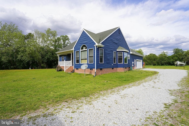 9557 Old Railroad Rd, Mardela Springs, MD 21837 - view of front of property featuring gravel driveway, crawl space, a front lawn, and a garage