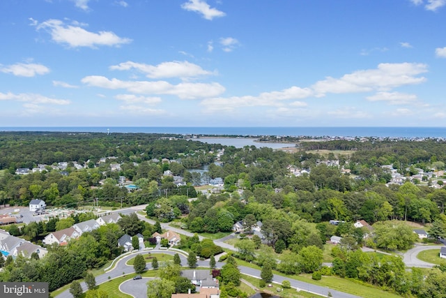 aerial view of a nearby body of water and a heavily wooded area