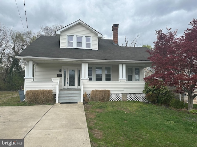7235 Baltimore Annapolis Blvd, Glen Burnie, MD 21061 - bungalow featuring a porch, a chimney, and a front lawn