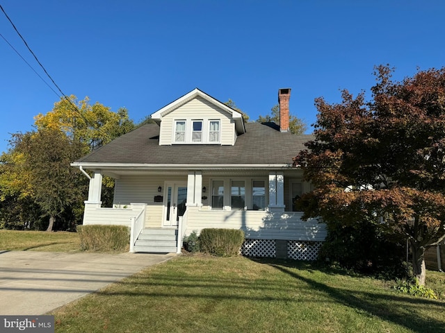 7235 Baltimore Annapolis Blvd, Glen Burnie, MD 21061 - bungalow-style home with covered porch, a front lawn, a chimney, and roof with shingles