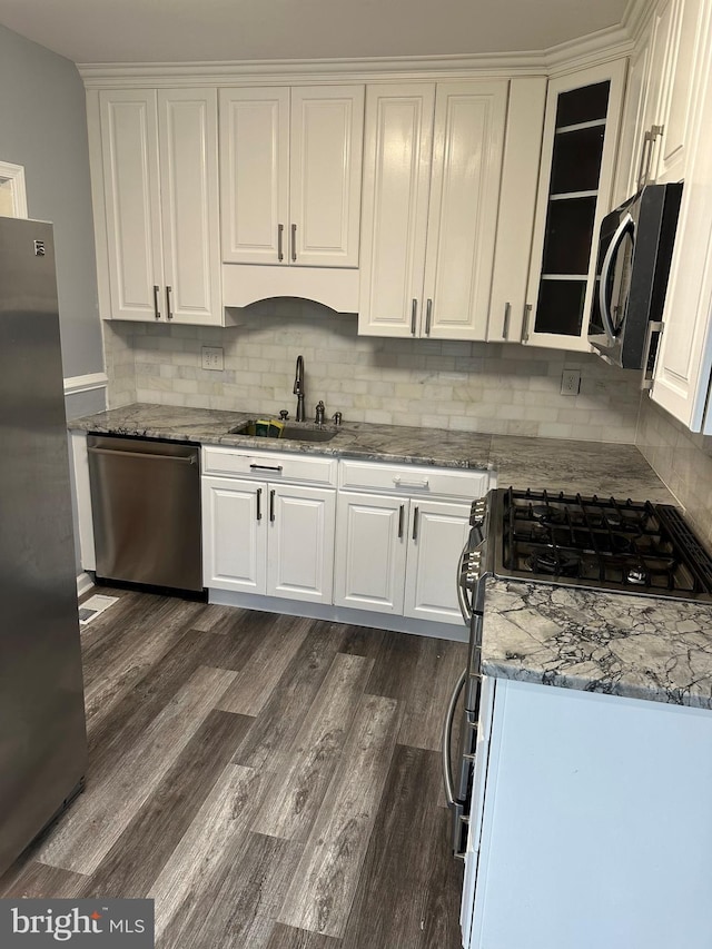 7235 Baltimore Annapolis Blvd, Glen Burnie, MD 21061 - kitchen with stainless steel appliances, a sink, dark wood-type flooring, and white cabinets