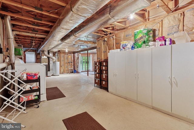 basement with water heater and washer / clothes dryer