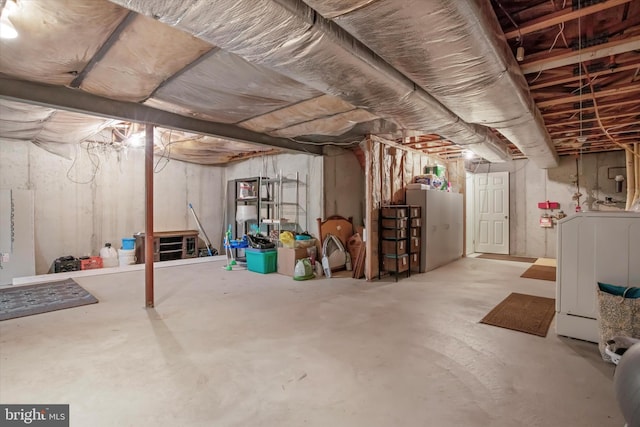 unfinished below grade area with washer / dryer