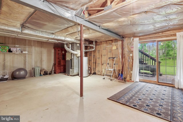 basement featuring water heater and heating unit