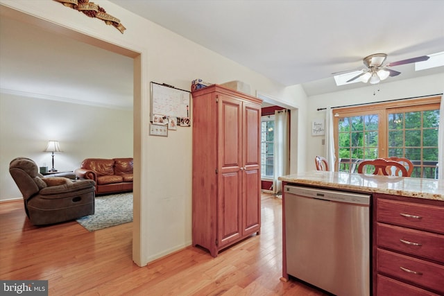 kitchen featuring dishwasher, light wood finished floors, ceiling fan, and baseboards