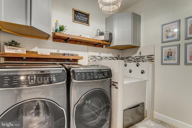 6034 Franconia Rd, Alexandria, VA 22310 - laundry room featuring washing machine and clothes dryer, cabinet space, baseboards, and light tile patterned flooring