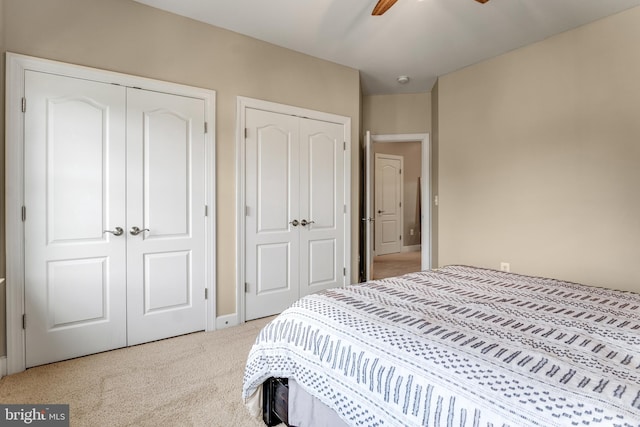 6034 Franconia Rd, Alexandria, VA 22310 - carpeted bedroom with two closets, ceiling fan, and baseboards