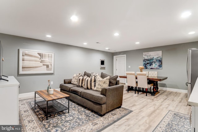 6034 Franconia Rd, Alexandria, VA 22310 - living area with recessed lighting, light wood-style floors, and baseboards