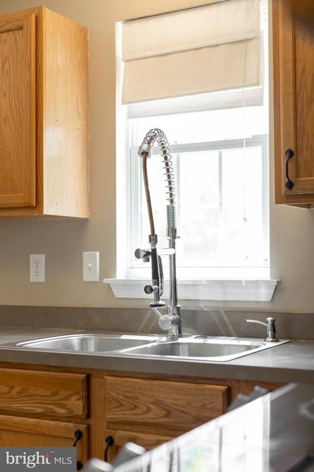 503 Forest Ave, Bellefonte, PA 16823 - kitchen featuring brown cabinetry and a sink