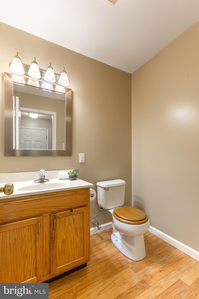 503 Forest Ave, Bellefonte, PA 16823 - half bath featuring toilet, wood finished floors, and baseboards