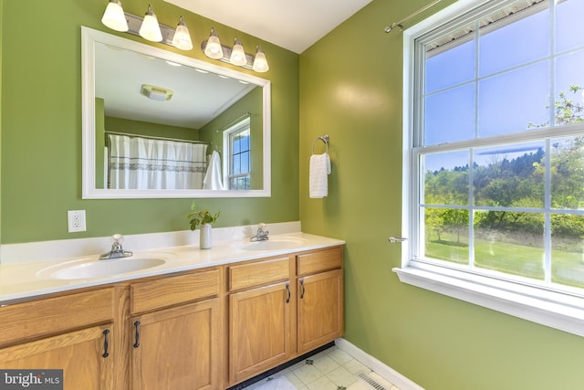 503 Forest Ave, Bellefonte, PA 16823 - full bathroom with double vanity, baseboards, and tile patterned floors