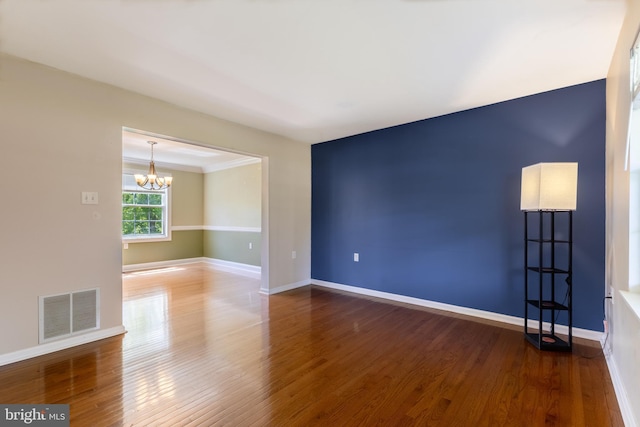 503 Forest Ave, Bellefonte, PA 16823 - unfurnished room with a chandelier, wood finished floors, and baseboards
