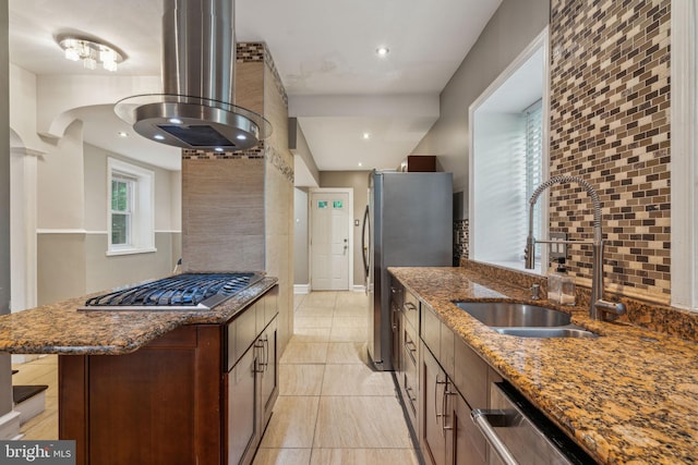 2424 Golf Rd, Philadelphia, PA 19131 - kitchen featuring a sink, appliances with stainless steel finishes, wall chimney exhaust hood, dark stone counters, and light tile patterned floors