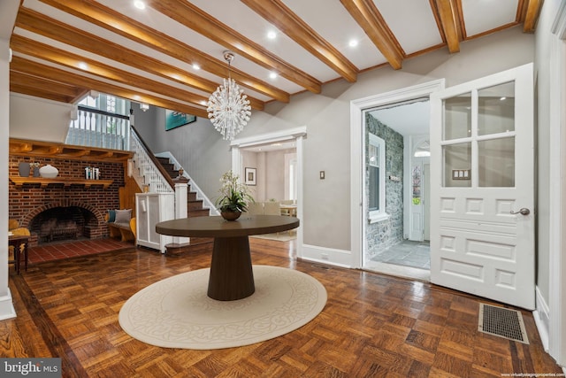 2424 Golf Rd, Philadelphia, PA 19131 - dining space featuring a fireplace, stairs, baseboards, a chandelier, and beam ceiling