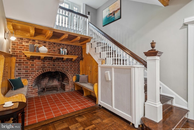2424 Golf Rd, Philadelphia, PA 19131 - unfurnished living room with stairway, a fireplace, and a high ceiling
