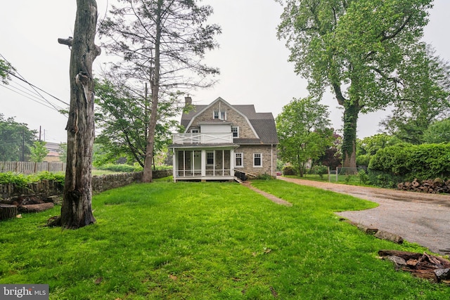 2424 Golf Rd, Philadelphia, PA 19131 - view of front facade with a gambrel roof, a chimney, and a sunroom