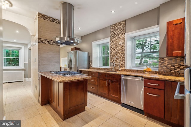 2424 Golf Rd, Philadelphia, PA 19131 - kitchen featuring appliances with stainless steel finishes, a sink, island range hood, backsplash, and light stone countertops