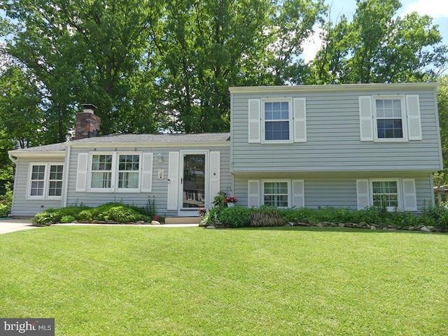 5 Bamborough Ct, Baltimore, MD 21236 - split level home featuring a front lawn and a chimney