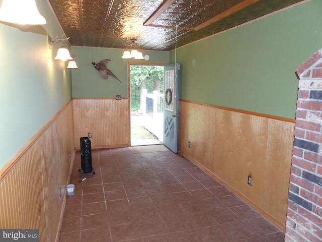 5 Bamborough Ct, Baltimore, MD 21236 - hall with a wainscoted wall, an ornate ceiling, wood walls, and tile patterned floors