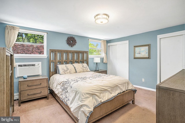 328 W Warren St, Norristown, PA 19401 - carpeted bedroom featuring baseboards, a baseboard heating unit, two closets, and a wall mounted air conditioner