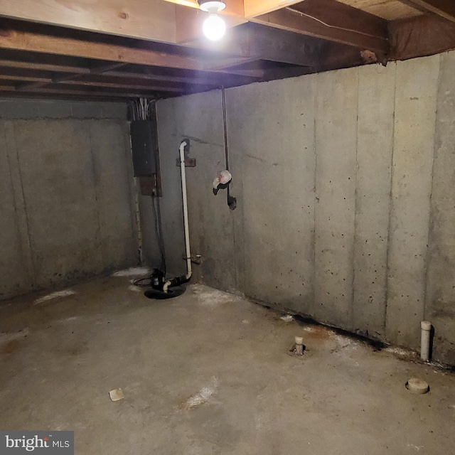 unfinished below grade area featuring electric panel