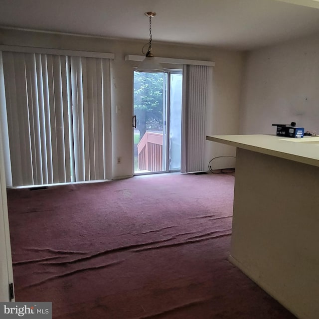 dining space with carpet floors