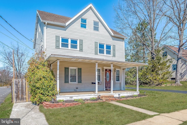 view of front of house featuring a porch and a front lawn
