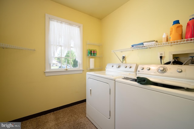 laundry area featuring washing machine and dryer, carpet, and baseboards