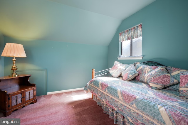 bedroom featuring vaulted ceiling, carpet floors, and baseboards
