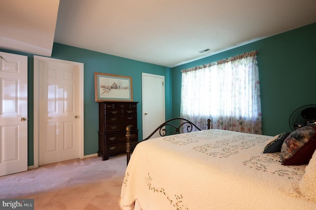 bedroom with light carpet