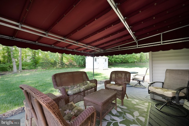 view of patio featuring a storage unit, an outdoor structure, a wooden deck, and an outdoor hangout area
