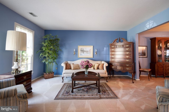 living area with carpet floors and baseboards