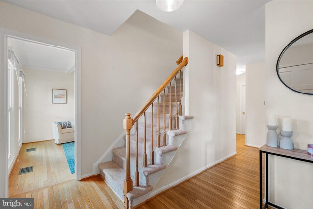 2112 Wittington Blvd, Alexandria, VA 22308 - stairway featuring hardwood / wood-style floors and baseboards