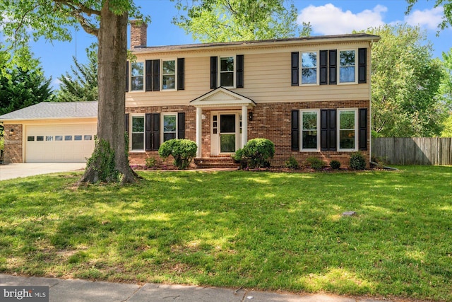 2112 Wittington Blvd, Alexandria, VA 22308 - colonial inspired home featuring brick siding, an attached garage, driveway, and a chimney