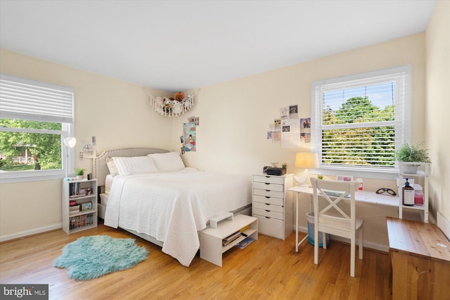 2112 Wittington Blvd, Alexandria, VA 22308 - bedroom featuring multiple windows, wood finished floors, and baseboards