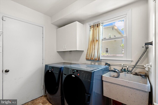 2112 Wittington Blvd, Alexandria, VA 22308 - laundry area featuring cabinet space and independent washer and dryer