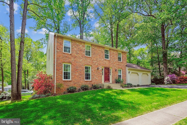 5938 New England Woods Dr, Burke, VA 22015 - colonial inspired home with a garage, asphalt driveway, a front yard, and brick siding