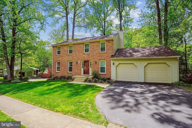 5938 New England Woods Dr, Burke, VA 22015 - colonial inspired home featuring a garage, asphalt driveway, a front yard, brick siding, and a chimney