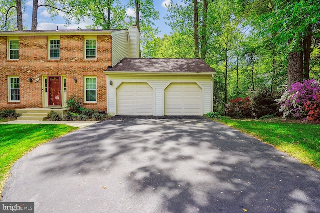 5938 New England Woods Dr, Burke, VA 22015 - colonial home with an attached garage, asphalt driveway, brick siding, and a chimney