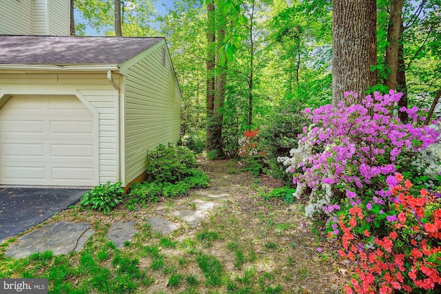 5938 New England Woods Dr, Burke, VA 22015 - view of yard featuring a garage