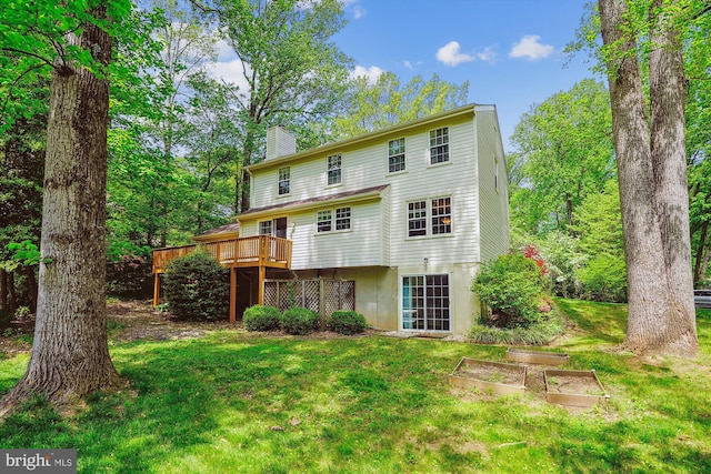 5938 New England Woods Dr, Burke, VA 22015 - rear view of property with a chimney, a yard, a deck, and a garden