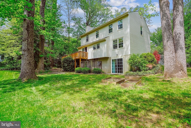 5938 New England Woods Dr, Burke, VA 22015 - rear view of property with a chimney, a yard, a vegetable garden, and a wooden deck