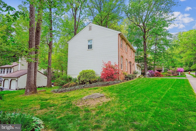 5938 New England Woods Dr, Burke, VA 22015 - view of home's exterior with a yard and brick siding